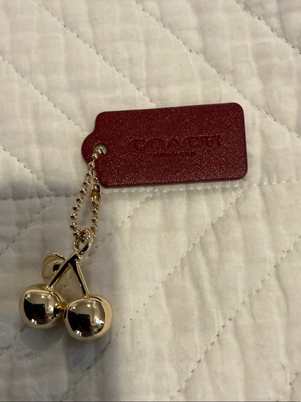 Coach Gold Cherry Charm with Red Leather Tag